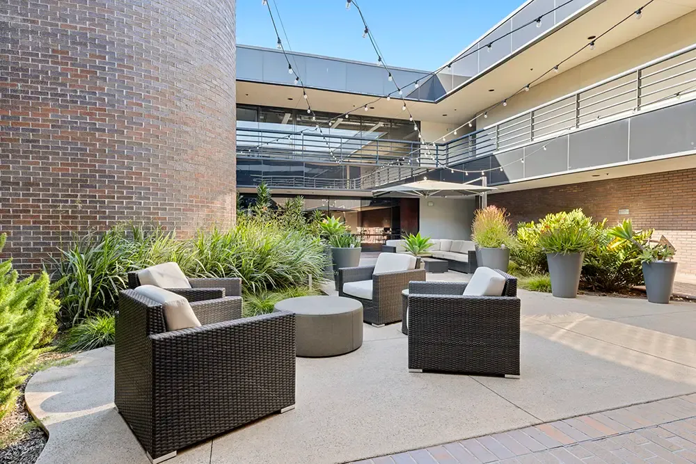 Courtyard with outdoor seating at the women's program office on Faraday Avenue in Carlsbad