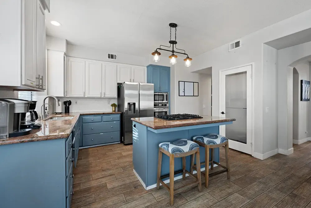 Kitchen with a blue island in Wings supportive housing