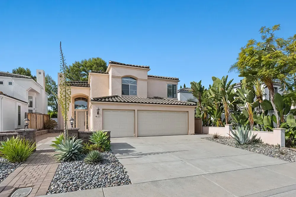 Front of a two-story Wings home in Vista with a landscaped drought-tolerant garden
